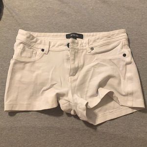 Small white shorts from Q. Brand is Active USA